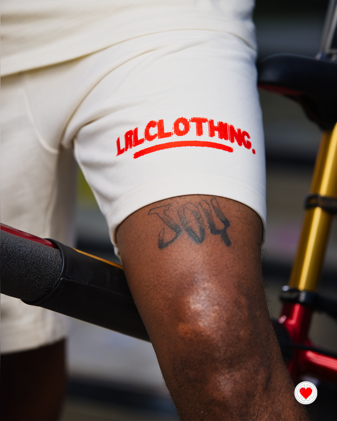 “Unisex Cream & Orange Visionary Shorts”