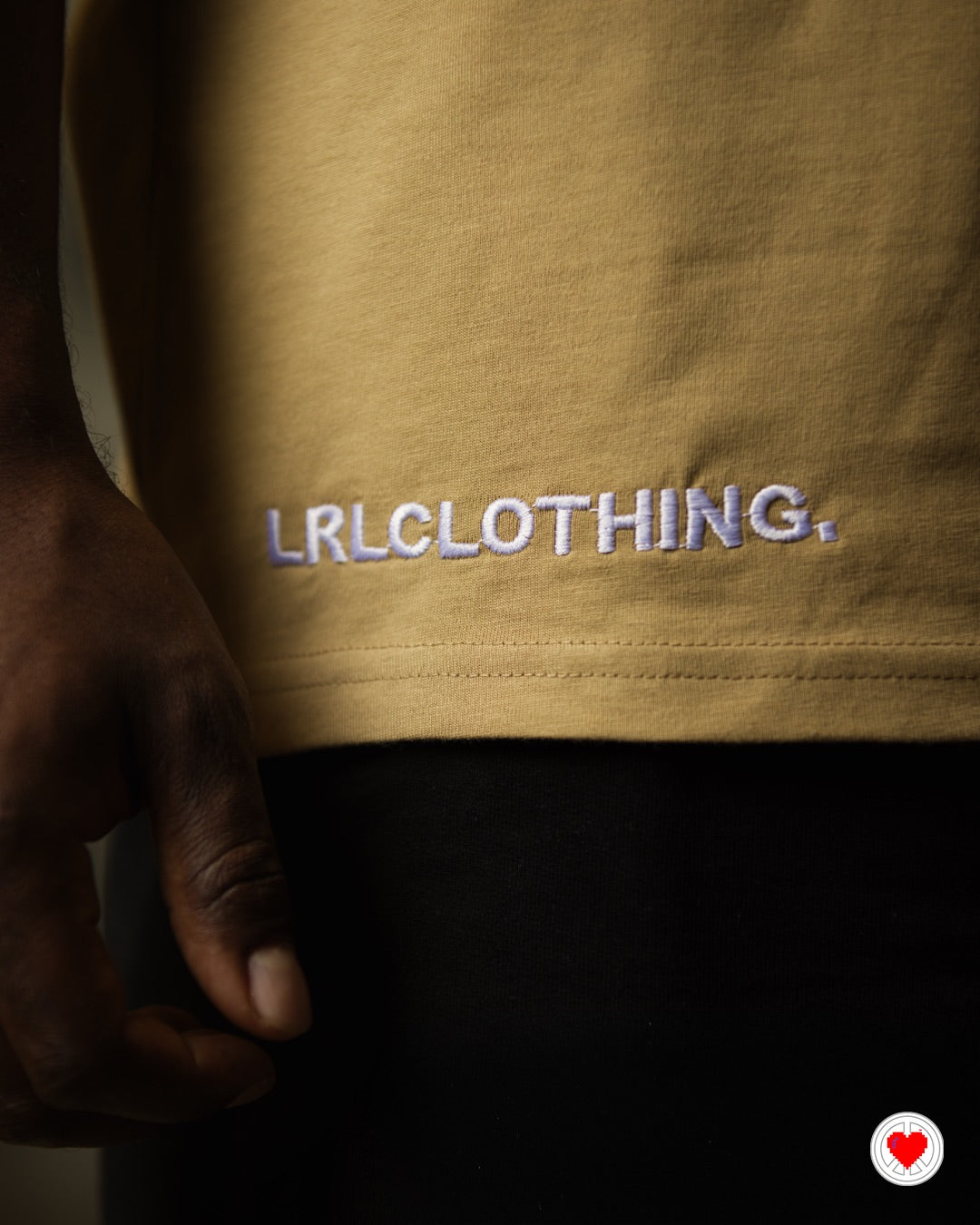 “Unisex Tan Stitched Heart Logo Tee”